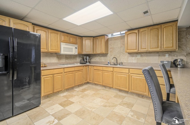 7740 Ternes St, Dearborn, MI 48126 - kitchen featuring a paneled ceiling, white appliances, a sink, light countertops, and backsplash