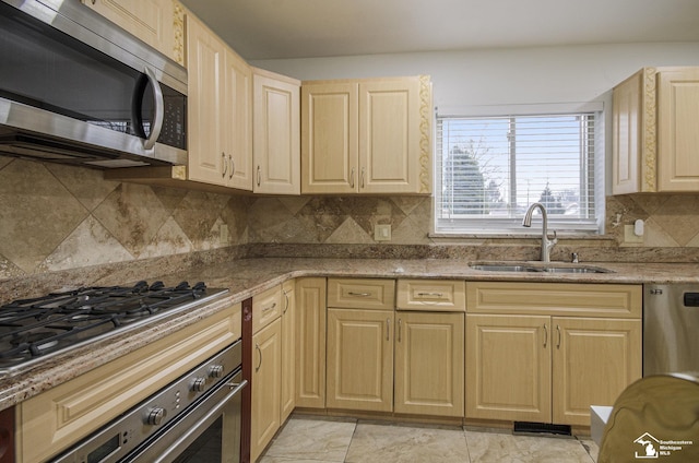 7740 Ternes St, Dearborn, MI 48126 - kitchen featuring appliances with stainless steel finishes, tasteful backsplash, a sink, and light brown cabinetry