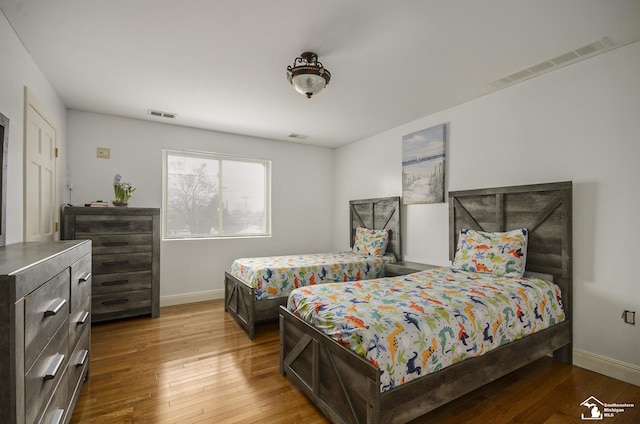 7740 Ternes St, Dearborn, MI 48126 - bedroom with baseboards, visible vents, and hardwood / wood-style floors