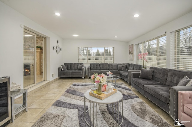 7740 Ternes St, Dearborn, MI 48126 - living area with light tile patterned floors, beverage cooler, a fireplace, and recessed lighting