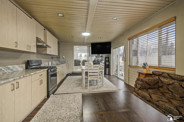 7740 Ternes St, Dearborn, MI 48126 - kitchen featuring gas range, wall chimney exhaust hood, dark wood-style flooring, light stone countertops, and a sink