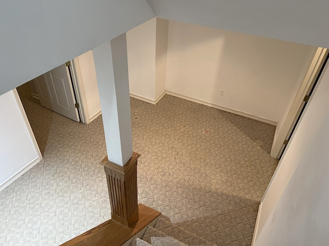 additional living space featuring baseboards and vaulted ceiling