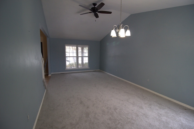 unfurnished room with lofted ceiling, carpet flooring, baseboards, and ceiling fan with notable chandelier