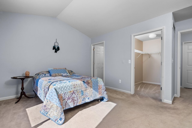 bedroom featuring lofted ceiling, baseboards, and light colored carpet