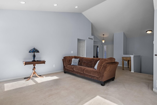 living area featuring high vaulted ceiling, recessed lighting, visible vents, and light colored carpet