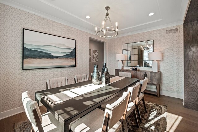 dining space with dark wood finished floors, recessed lighting, an inviting chandelier, baseboards, and wallpapered walls