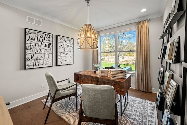 dining area featuring ornamental molding, dark wood-type flooring, visible vents, and baseboards