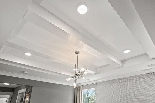 interior details featuring beamed ceiling, recessed lighting, and a notable chandelier
