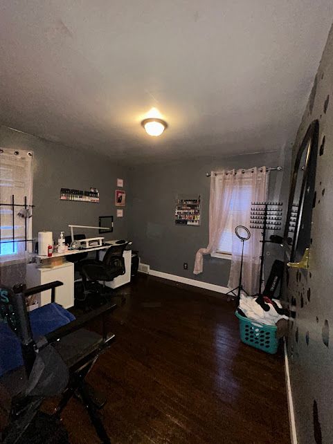 office space featuring dark wood-style floors and baseboards