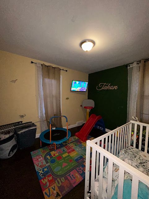 bedroom featuring baseboards