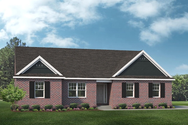 view of front of house featuring a front yard, brick siding, and roof with shingles