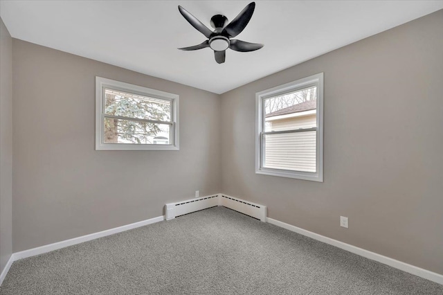 unfurnished room with carpet floors, a baseboard radiator, plenty of natural light, and baseboards