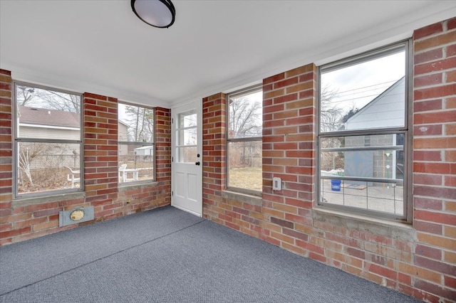 unfurnished sunroom with a healthy amount of sunlight