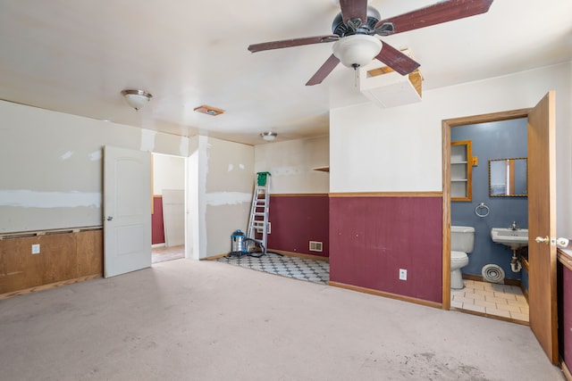 misc room with ceiling fan and a sink