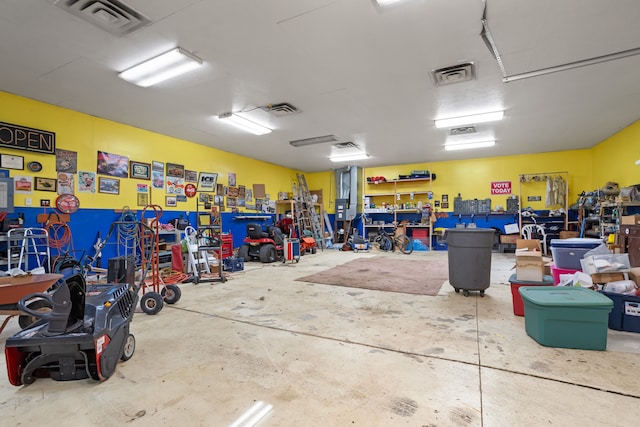 garage with visible vents and a workshop area