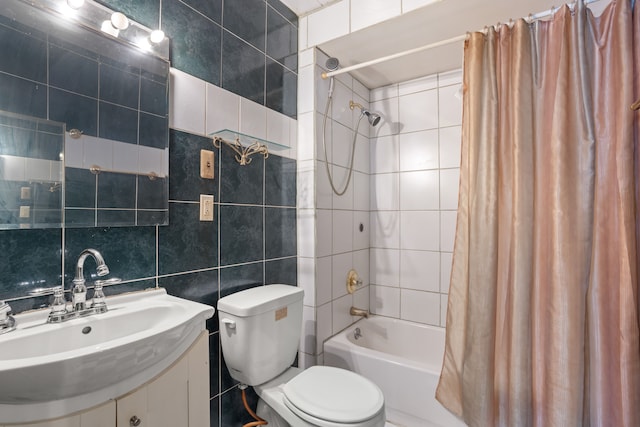 bathroom with shower / tub combo, decorative backsplash, toilet, vanity, and tile walls