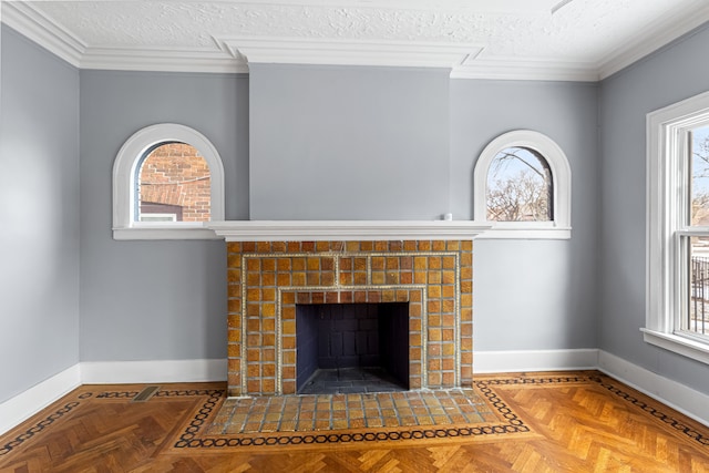 details with a textured ceiling, crown molding, a tile fireplace, and baseboards