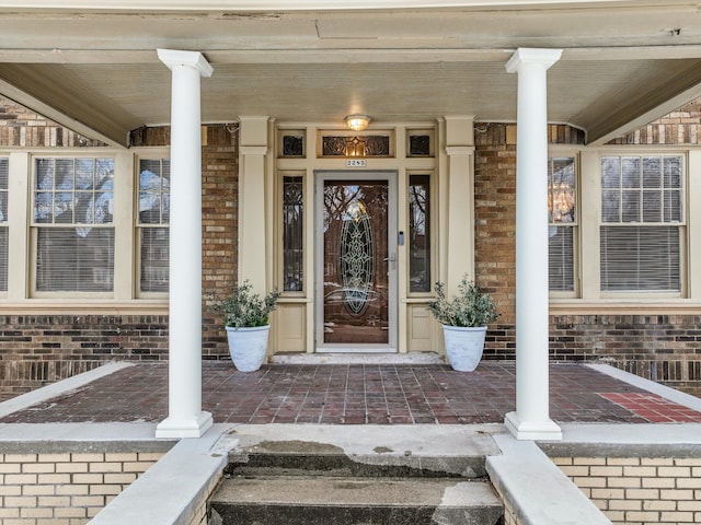 property entrance with brick siding