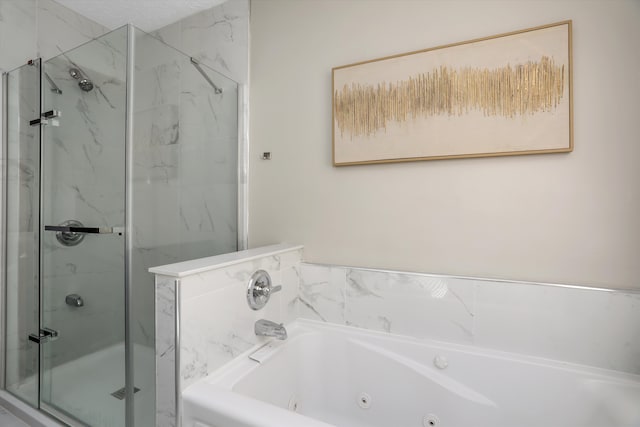 bathroom featuring a whirlpool tub and a stall shower