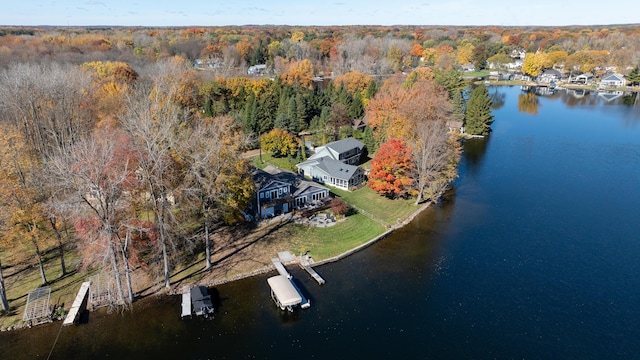 bird's eye view featuring a view of trees and a water view