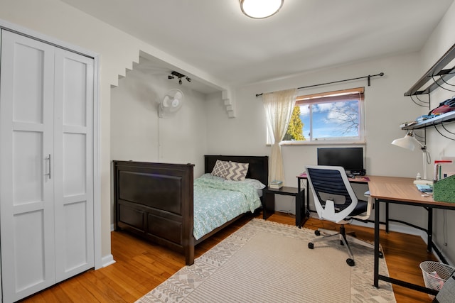 bedroom with light wood finished floors