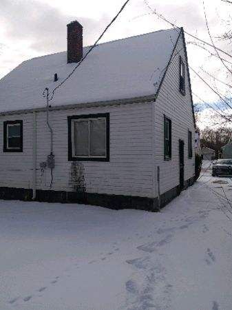 view of property exterior featuring a chimney