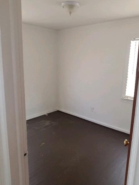 spare room featuring baseboards