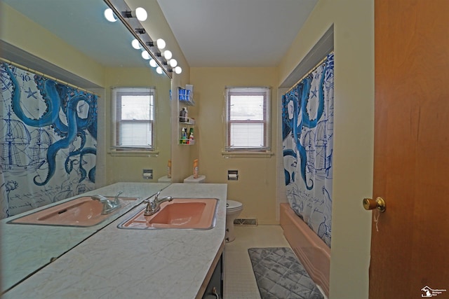 bathroom with shower / tub combo with curtain, visible vents, toilet, vanity, and tile patterned floors