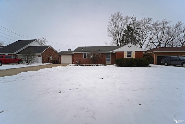 ranch-style house with a garage and brick siding