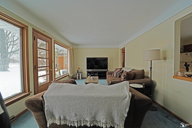 living room featuring carpet and baseboards