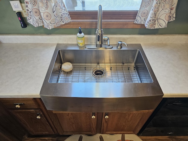 room details featuring light countertops and a sink