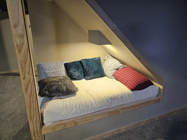 bedroom featuring lofted ceiling and carpet floors