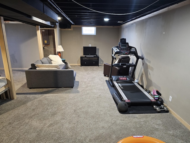 workout area featuring carpet flooring and baseboards