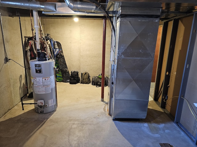 unfinished basement with gas water heater and heating unit