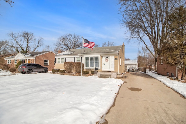 bungalow featuring a chimney