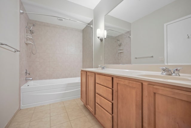 full bath featuring double vanity, tub / shower combination, a sink, and tile patterned floors