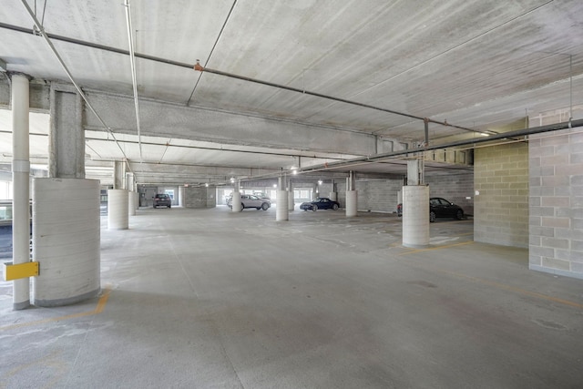 parking deck featuring concrete block wall