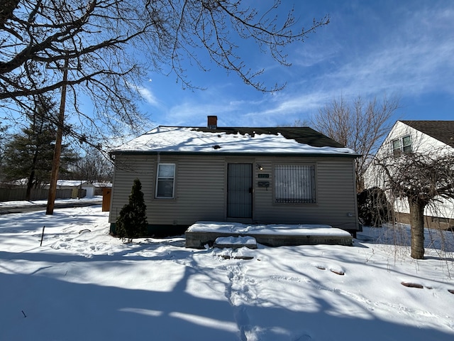 view of front of house with a chimney