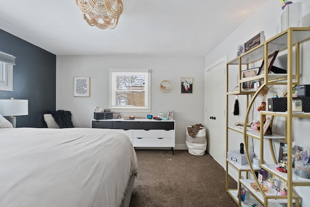 bedroom featuring dark colored carpet