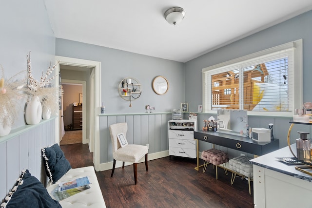 home office featuring dark wood-style floors and a wainscoted wall