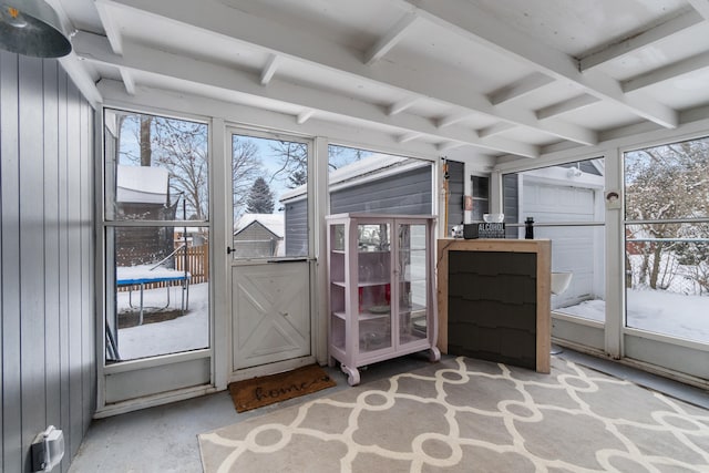 sunroom / solarium featuring a wealth of natural light and beam ceiling