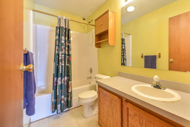 full bath with a textured ceiling, toilet, vanity, tile patterned floors, and shower / bath combo with shower curtain