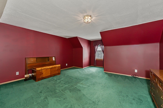 bonus room with a textured ceiling, carpet flooring, lofted ceiling, and baseboards