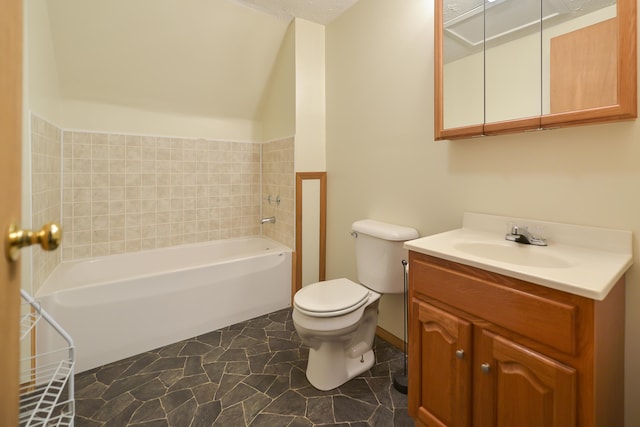 full bathroom featuring toilet, a bathtub, and vanity