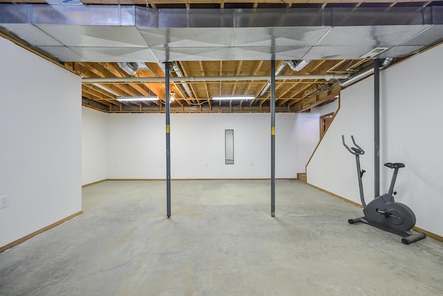 unfinished basement featuring baseboards