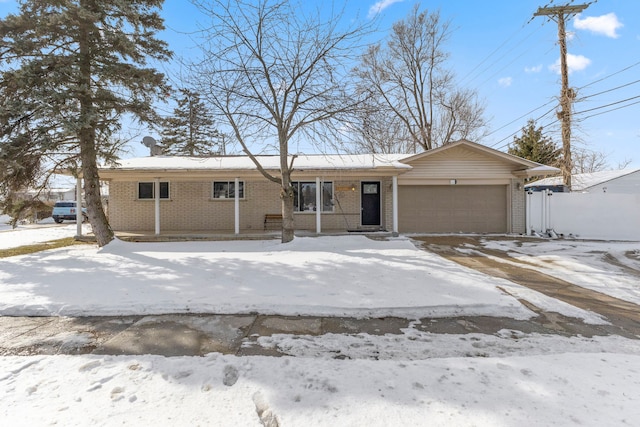 view of front of home with an attached garage and brick siding