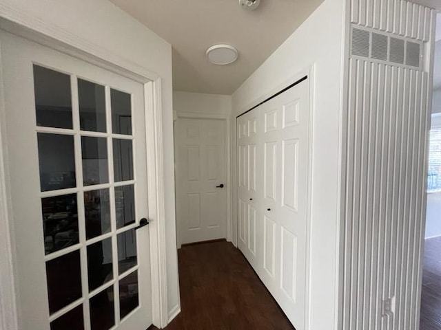 hall with dark wood-style floors