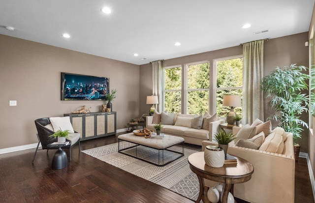 living room featuring dark wood-style floors, recessed lighting, and baseboards