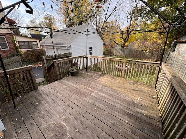 wooden terrace featuring a fenced backyard