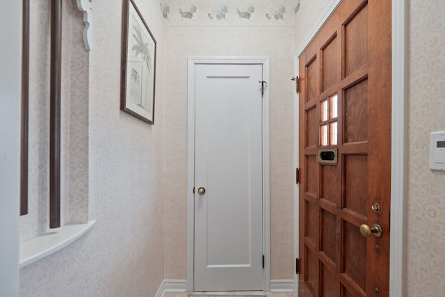 interior space featuring wallpapered walls